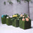 Artificial flower arrangements in moss-covered boxes.